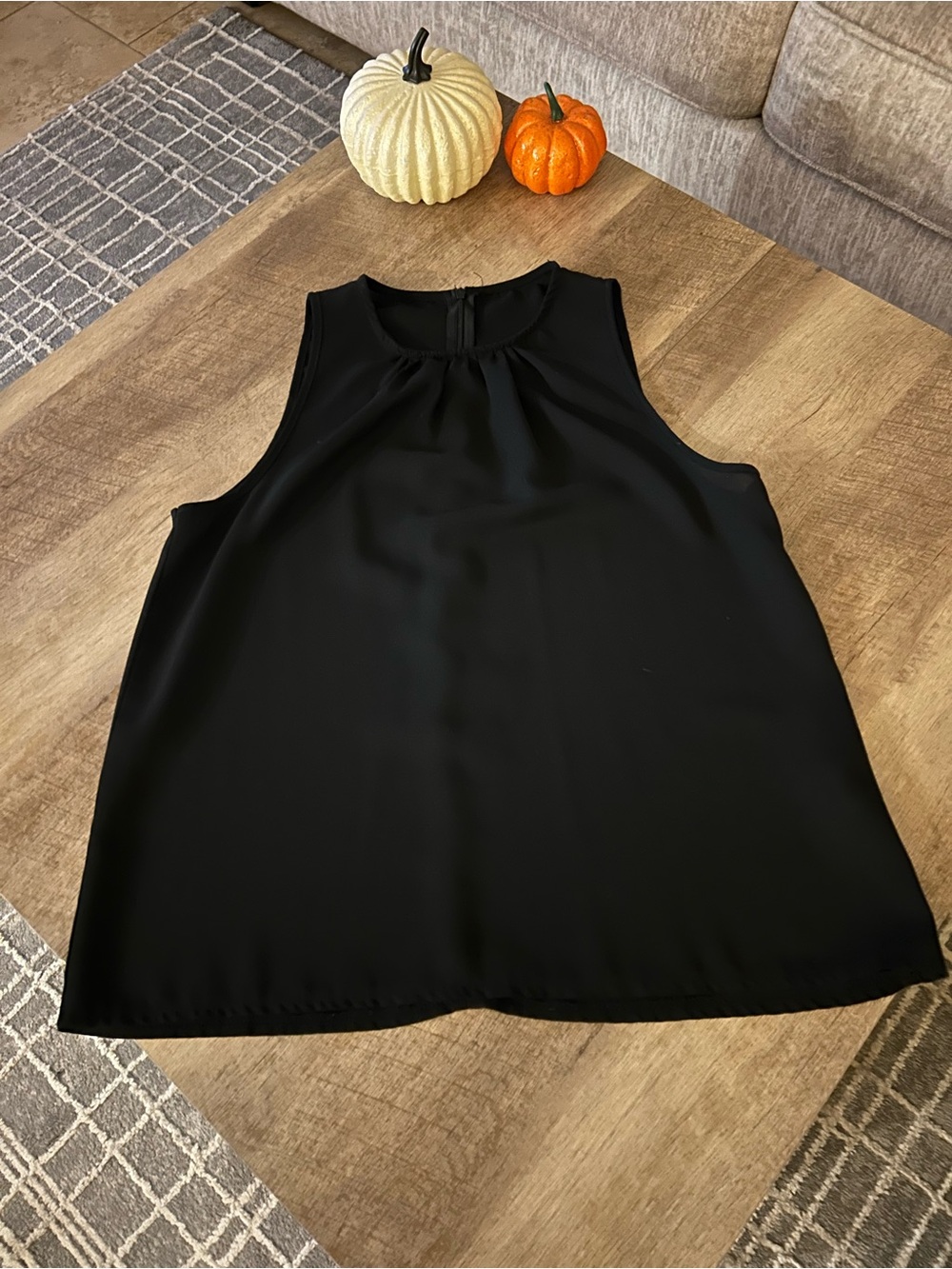 Classic Black Sleeveless Women's Top with zipper back.